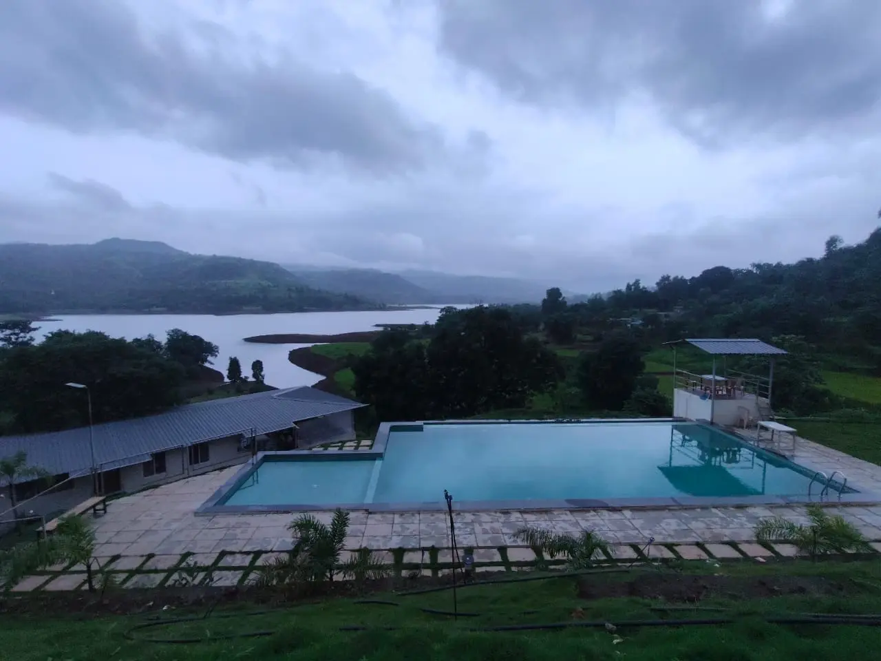 Infinity pool with a tranquil view, representing leisure and attentive service.